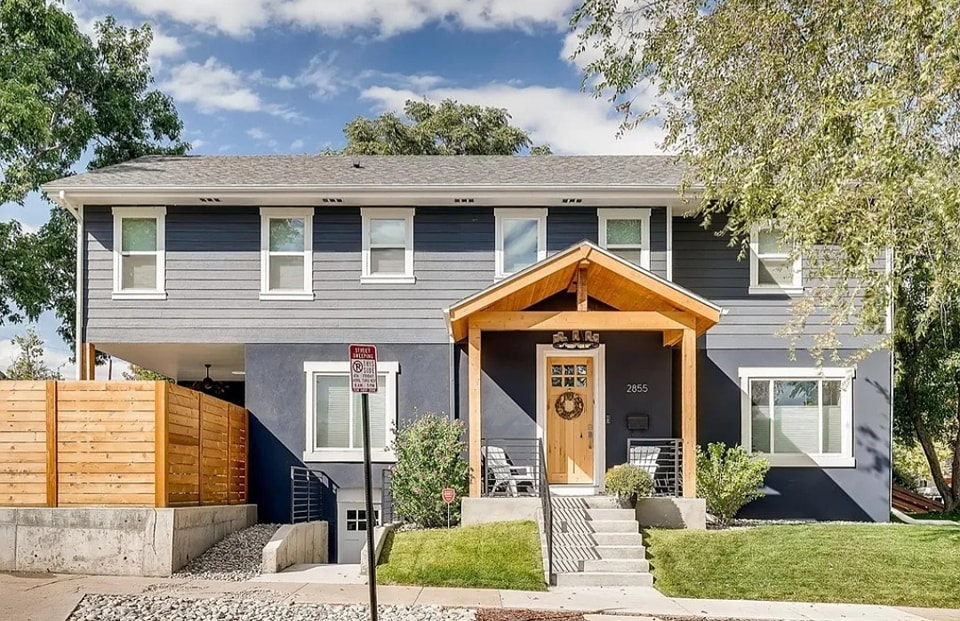 Completed navy blue duplex exterior built by 303 Construction in Denver