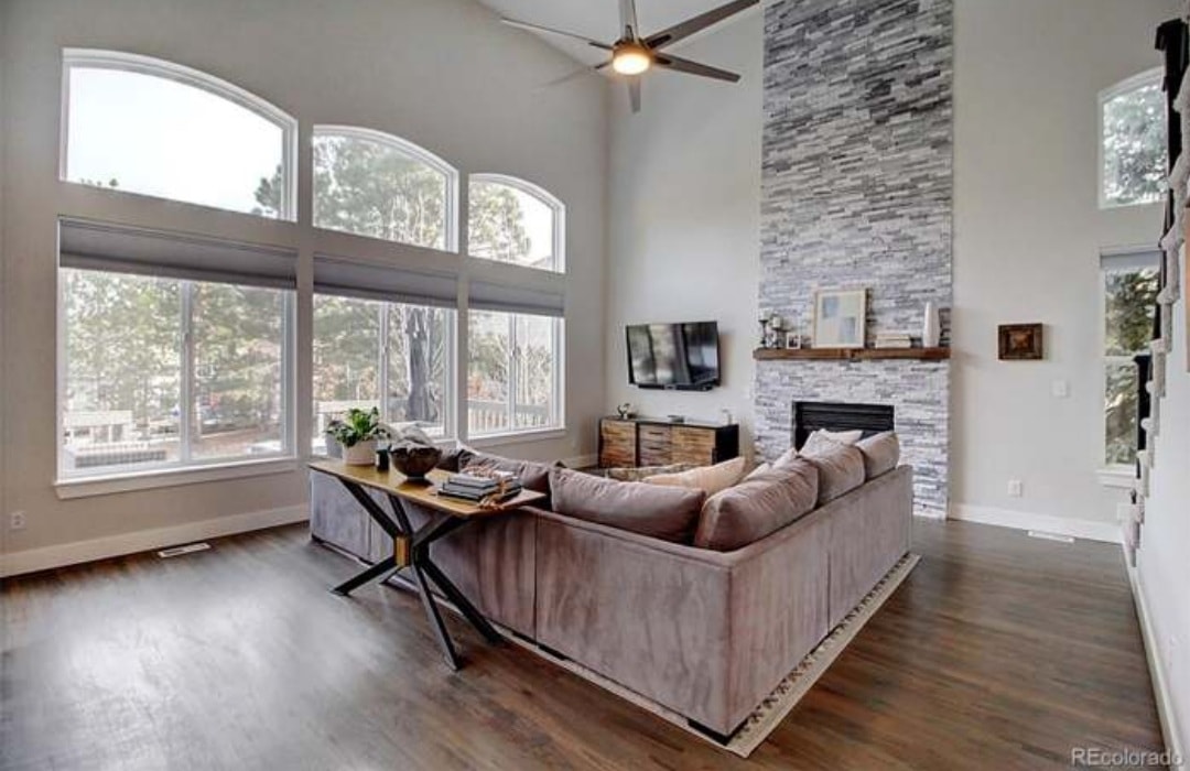 Great room with floor-to-ceiling stone fireplace built by 303 Construction